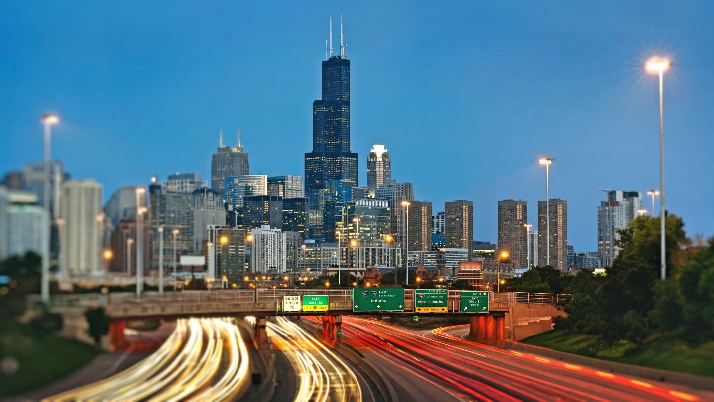Berryman Transfer and Storage Inc (Joliet/Chicago), B2B Logistics and Transportation on Chicago skyline and highways at night